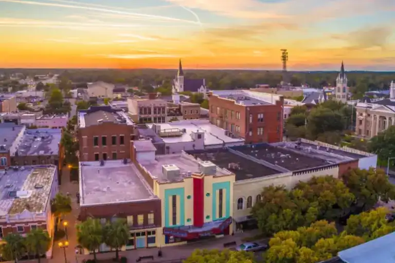 Colorful buildings in a small town at sunset.