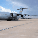 Military cargo aircraft parked on the tarmac at Altus Air Force Base.